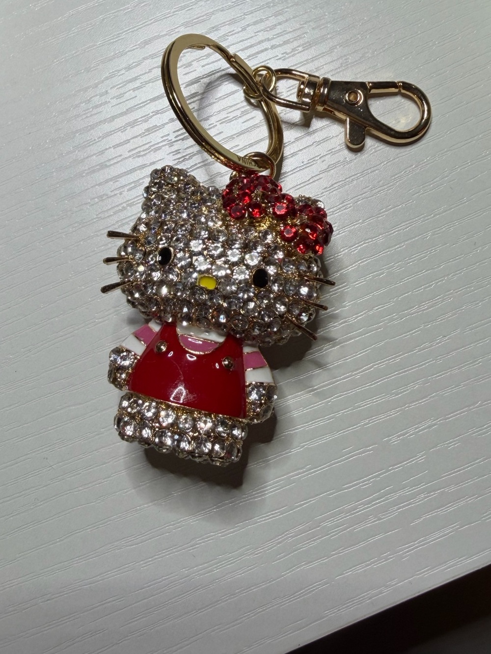 Hello Kitty Gold-Tone Crystal Bag Charm Keychain with Red Enamel Dress